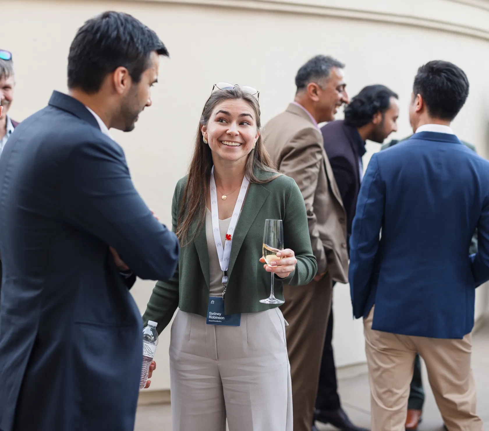 Attendees networking at an LSI summit reception